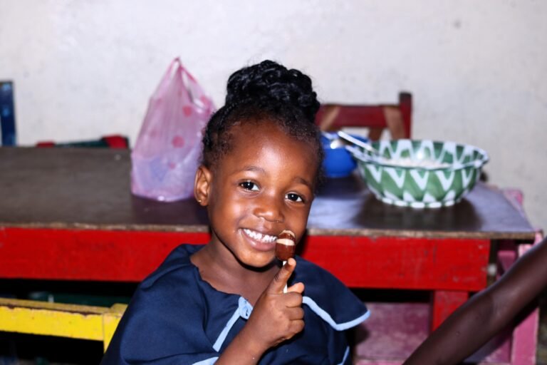 Nursery Student f Antioch Baptist Schoollicking candy